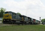 CSX 7379 leads a long train thru town